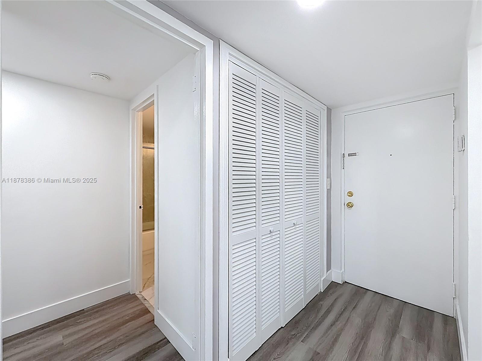 17620 Atlantic Boulevard, Unit 505 Sunny Isles Beach, FL 33160 - Photo 10 of 35 a view of a room with wooden floor