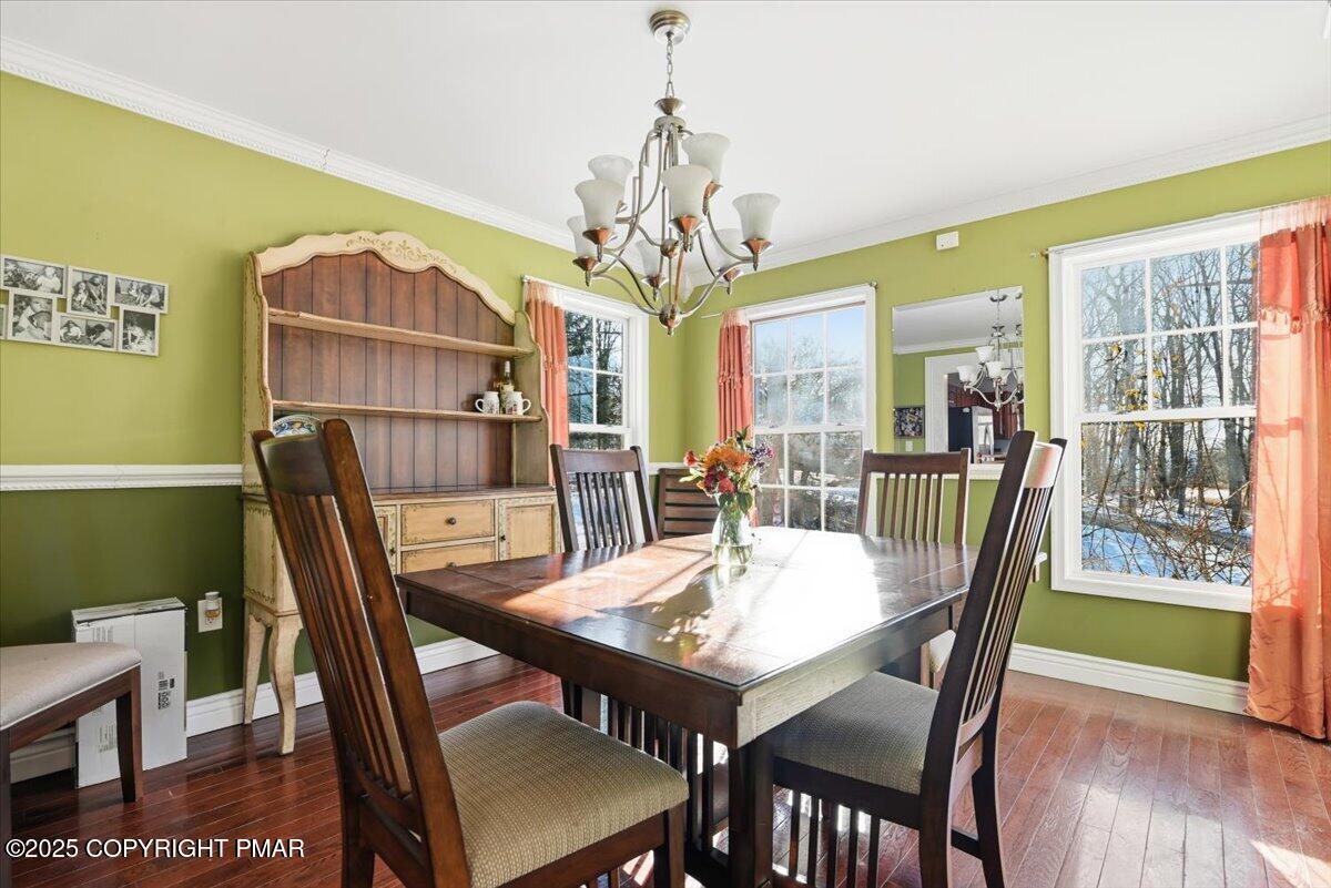 106 Ashley Court Bushkill, PA 18324 - Photo 19 of 61 a view of a dining room with furniture window and wooden floor