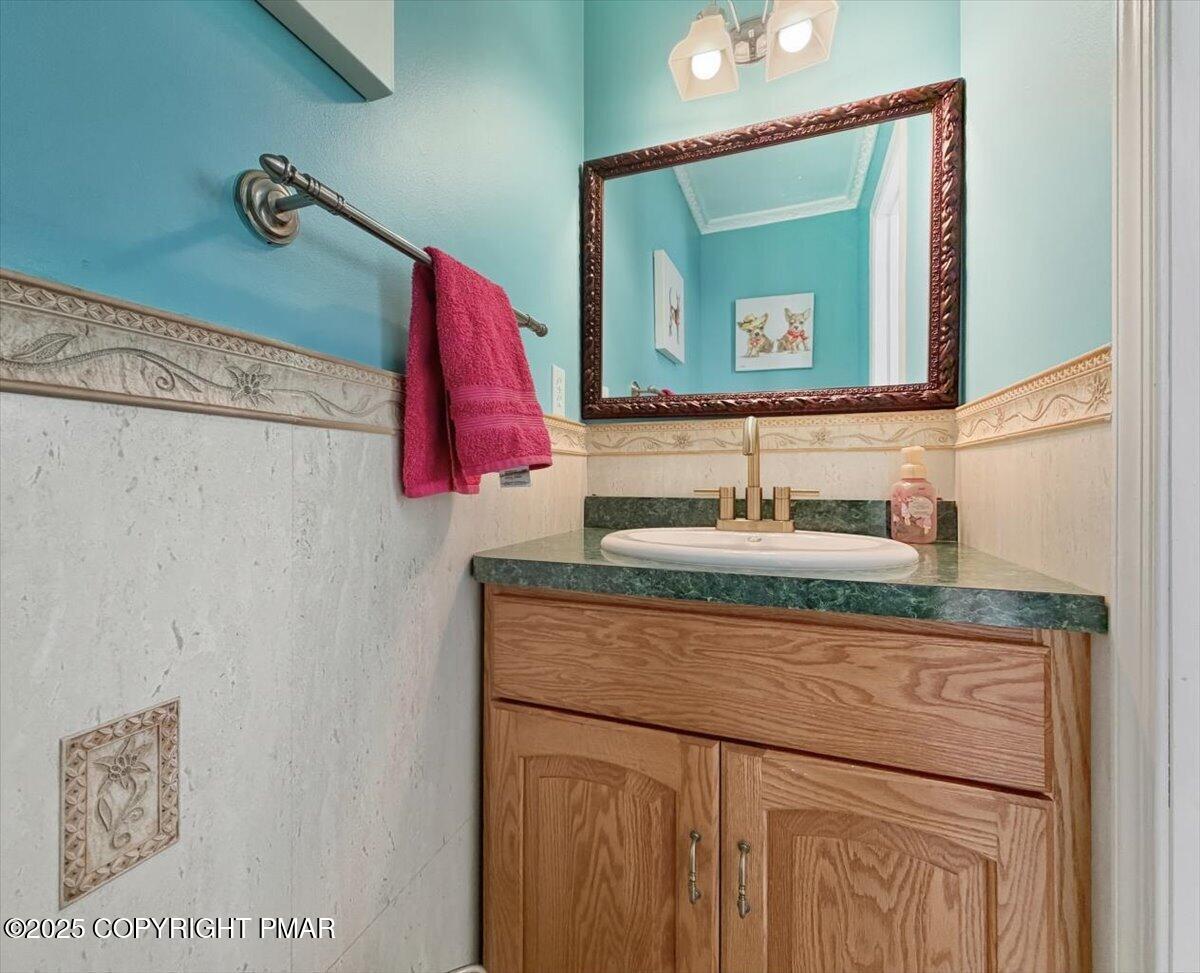 106 Ashley Court Bushkill, PA 18324 - Photo 20 of 61 a bathroom with a sink vanity and a mirror