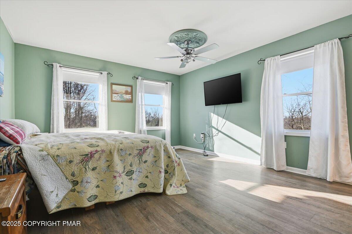 106 Ashley Court Bushkill, PA 18324 - Photo 29 of 61 a bedroom with a bed and a flat screen tv