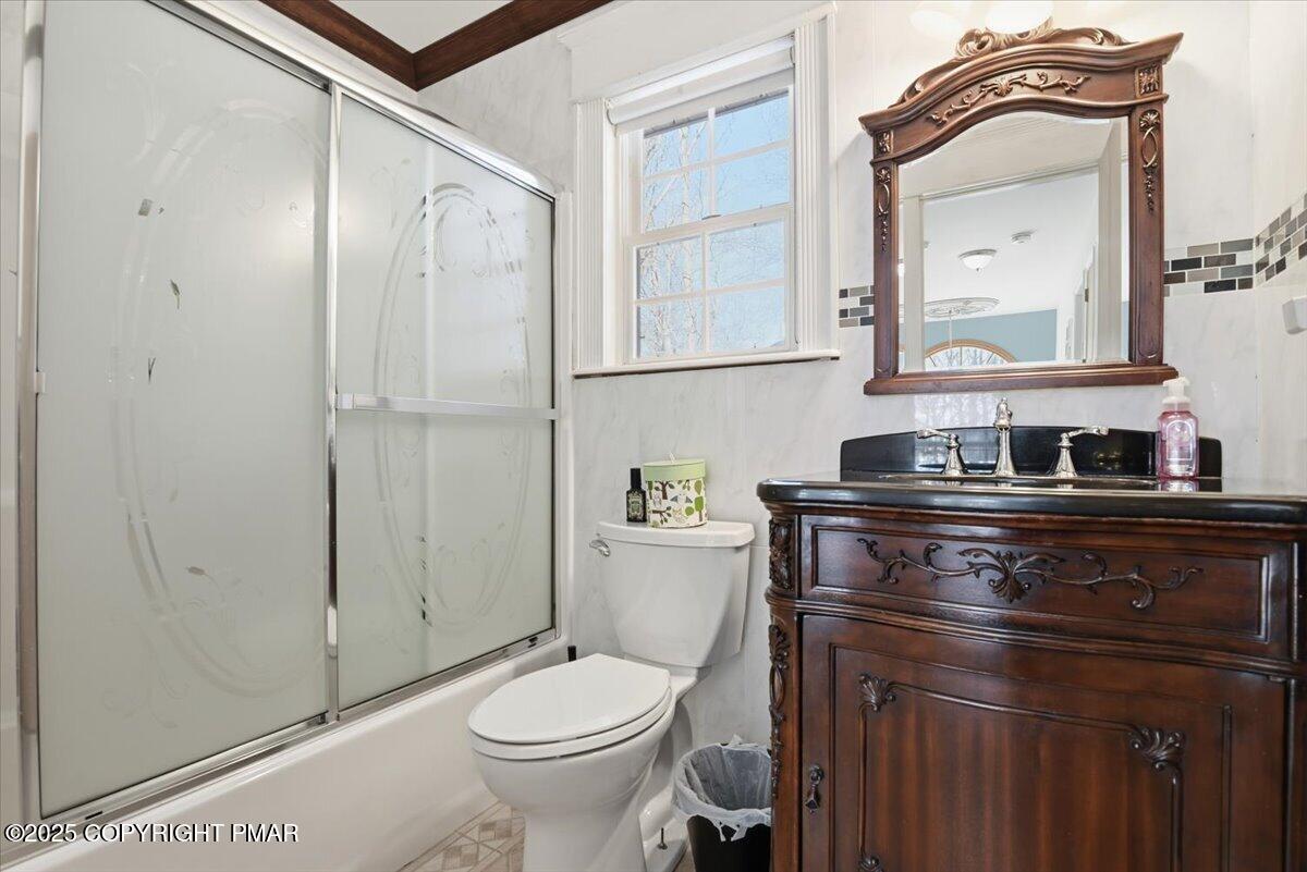 106 Ashley Court Bushkill, PA 18324 - Photo 33 of 61 a bathroom with a toilet a sink and mirror