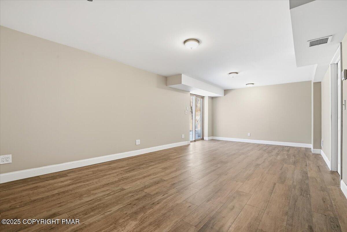 106 Ashley Court Bushkill, PA 18324 - Photo 36 of 61 a view of an empty room with wooden floor