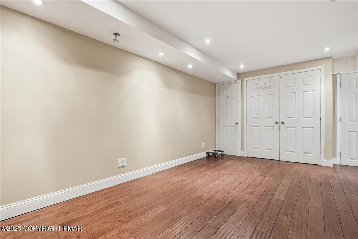 106 Ashley Court Bushkill, PA 18324 - Photo 40 of 61 a view of an empty room with wooden floor