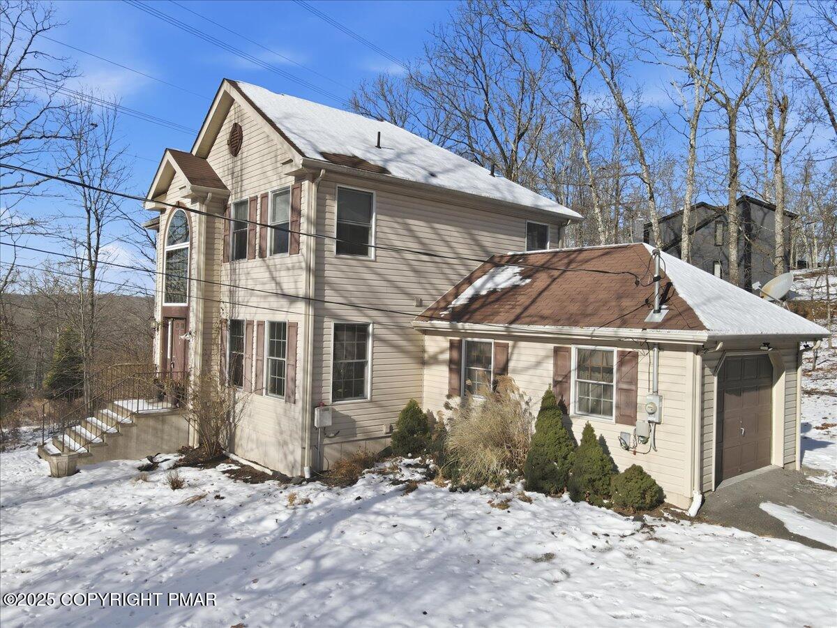 106 Ashley Court Bushkill, PA 18324 - Photo 4 of 61 a view of a house with a yard and large tree