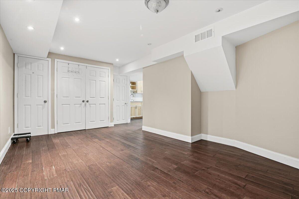 106 Ashley Court Bushkill, PA 18324 - Photo 41 of 61 a view of an empty room with wooden floor