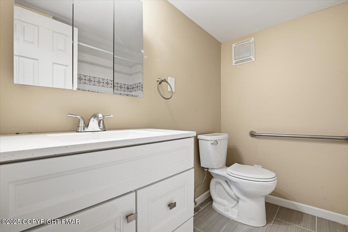 106 Ashley Court Bushkill, PA 18324 - Photo 43 of 61 a bathroom with a toilet sink and mirror