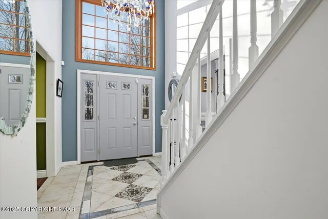 a view of a livingroom with furniture and windows