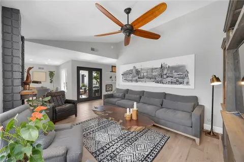 a living room with furniture and a rug