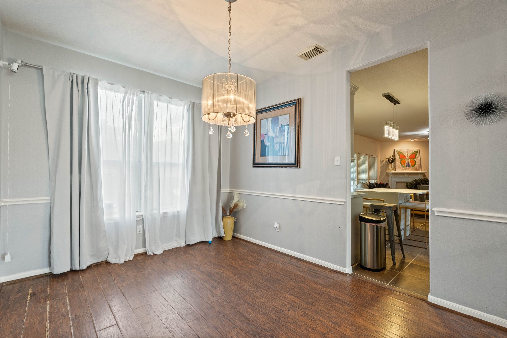 1908 Northampton Drive Conroe, TX 77303 - Photo 13 of 44 an empty room with wooden floor and windows