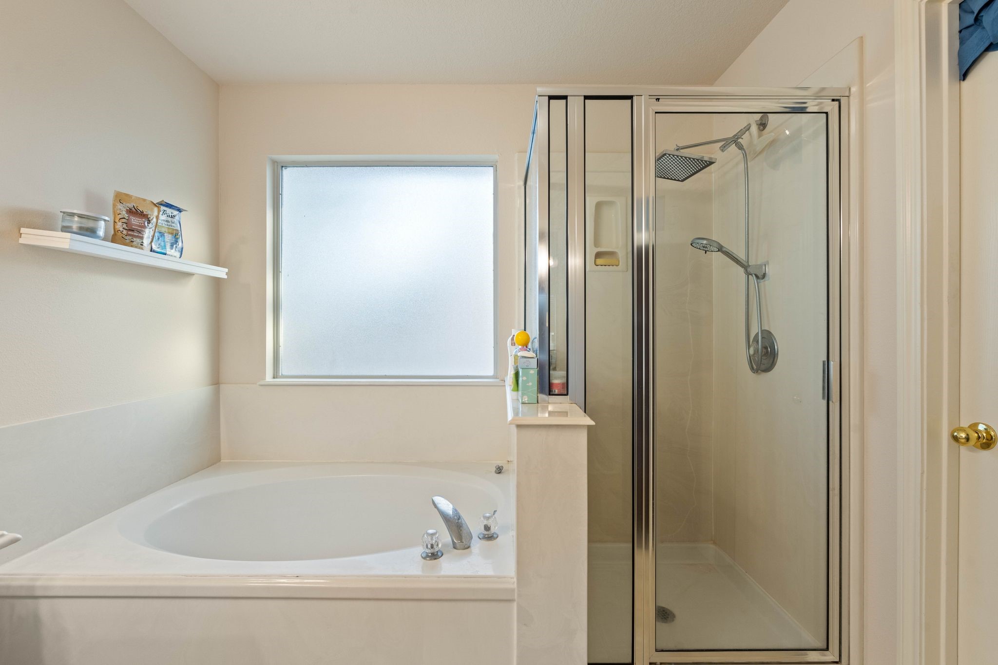 1908 Northampton Drive Conroe, TX 77303 - Photo 23 of 44 a bathroom with a bathtub and a shower