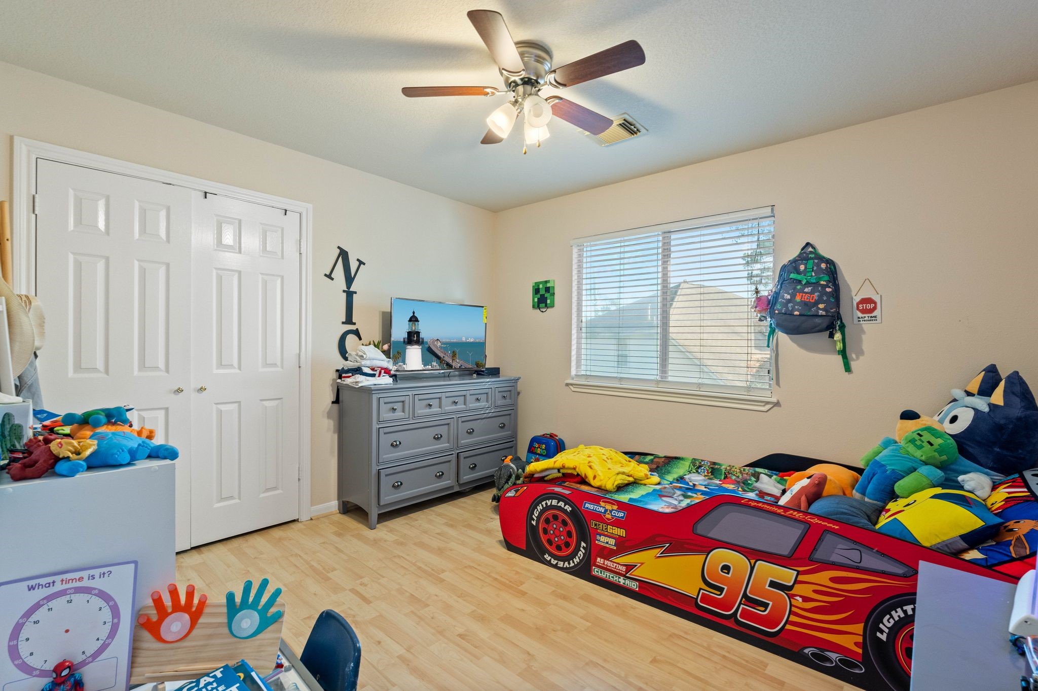 1908 Northampton Drive Conroe, TX 77303 - Photo 24 of 44 a bedroom that has a bed and a dresser in it