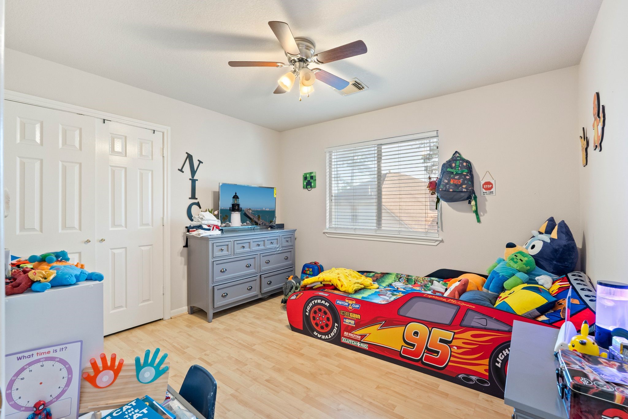 1908 Northampton Drive Conroe, TX 77303 - Photo 25 of 44 a bedroom that has a bed and a dresser in it