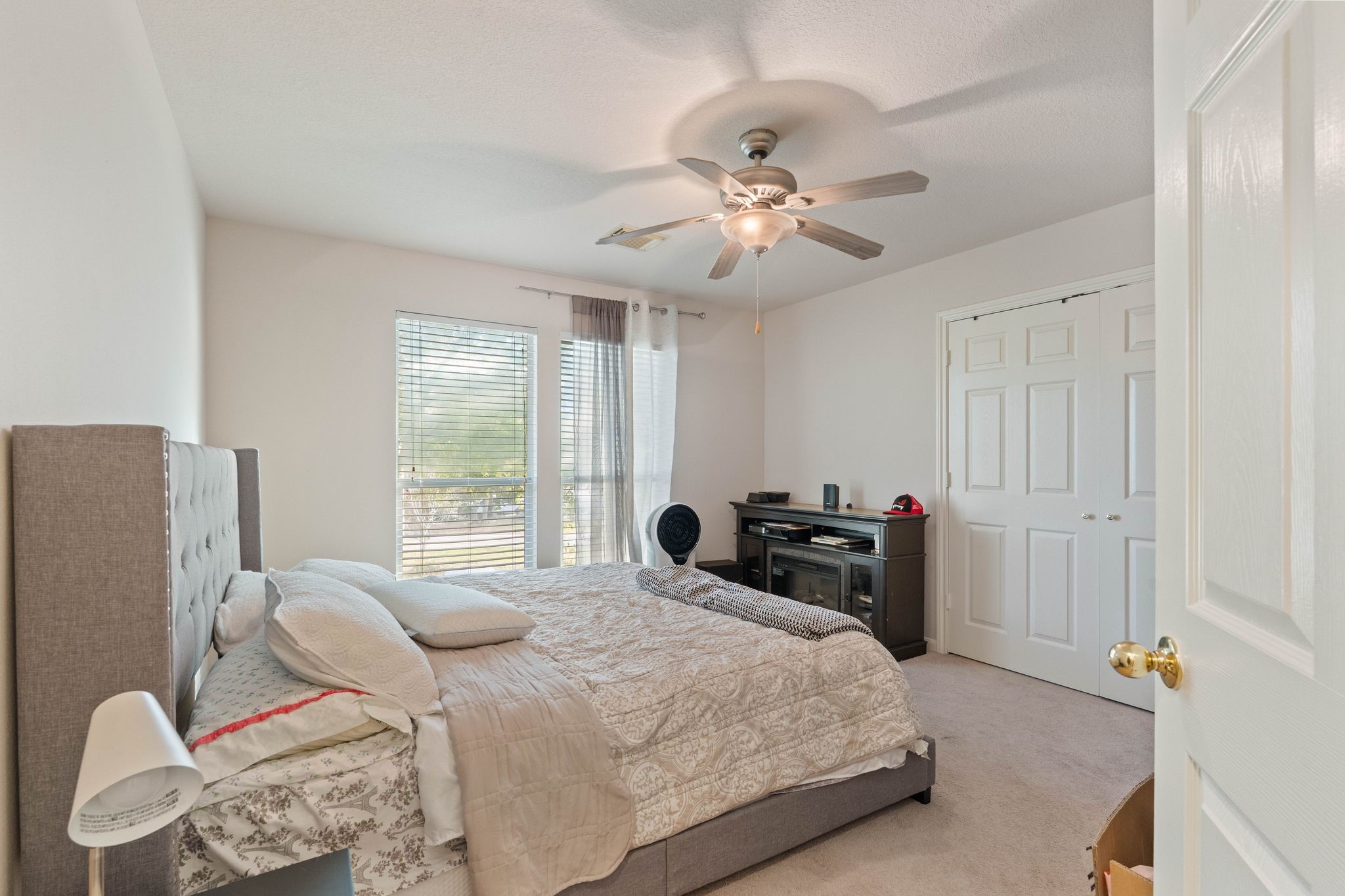 1908 Northampton Drive Conroe, TX 77303 - Photo 26 of 44 a bedroom with a bed and furniture