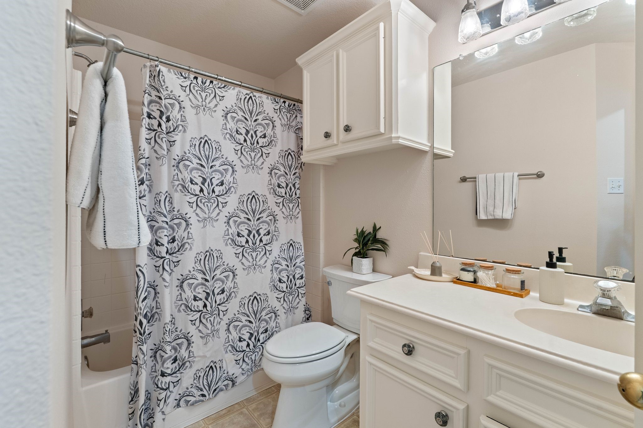 1908 Northampton Drive Conroe, TX 77303 - Photo 29 of 44 a bathroom with a sink toilet and shower