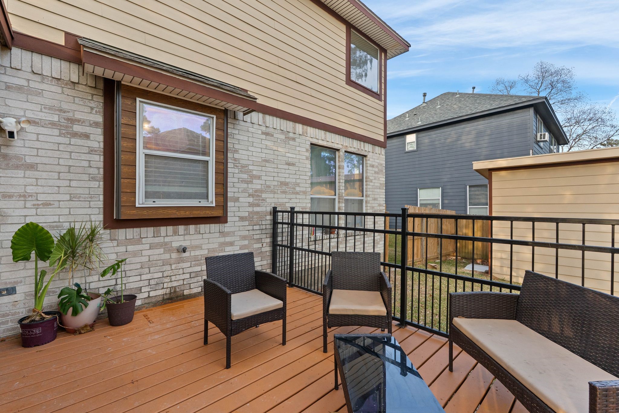 1908 Northampton Drive Conroe, TX 77303 - Photo 34 of 44 a view of a balcony with chairs and wooden floor