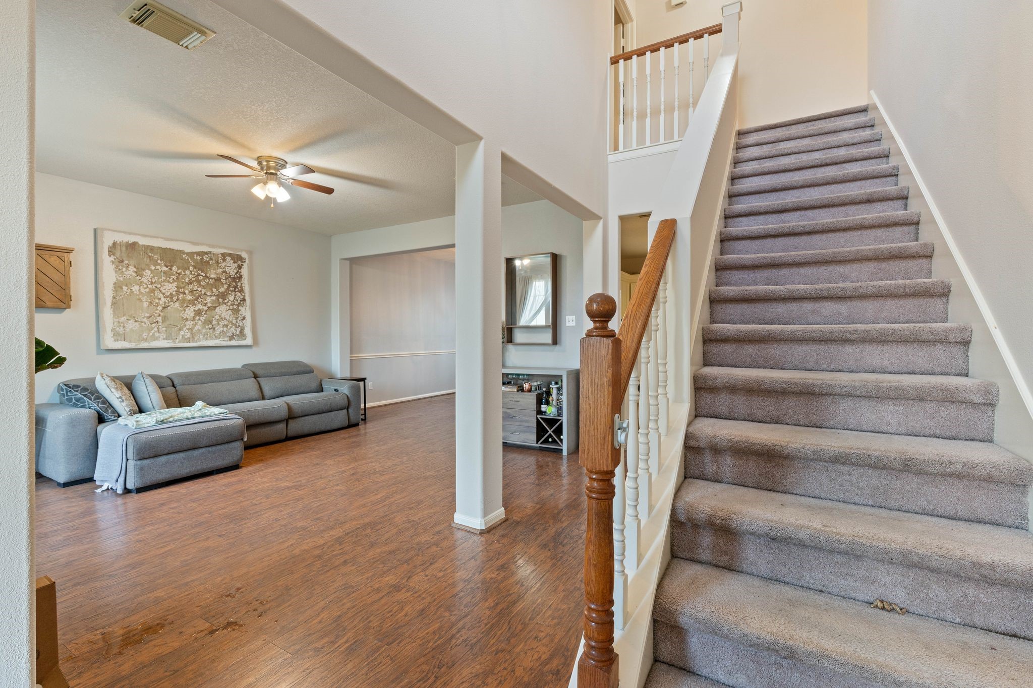1908 Northampton Drive Conroe, TX 77303 - Photo 4 of 44 a living room with furniture and stairs