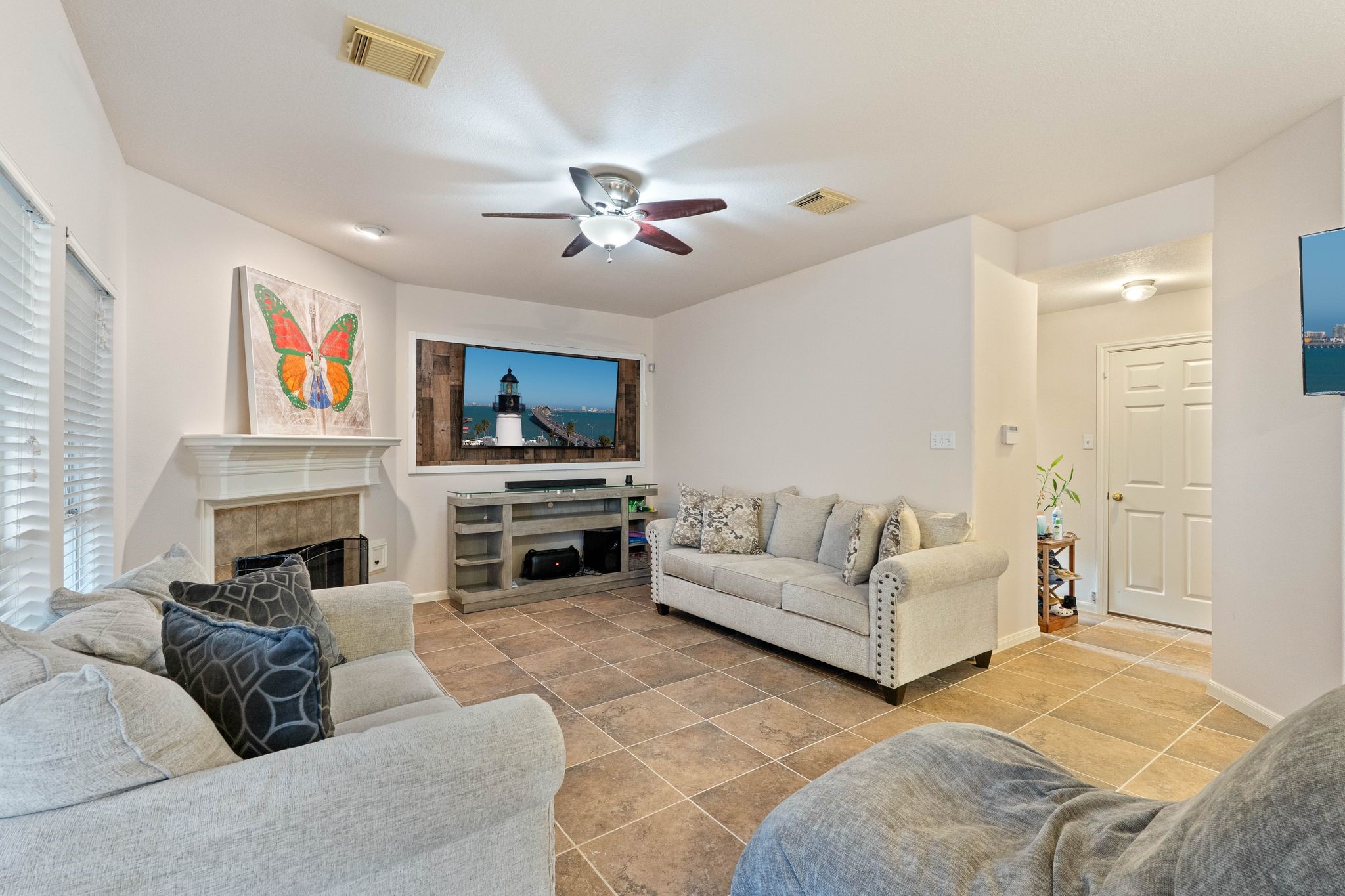 1908 Northampton Drive Conroe, TX 77303 - Photo 7 of 44 a living room with furniture a fireplace and a flat screen tv