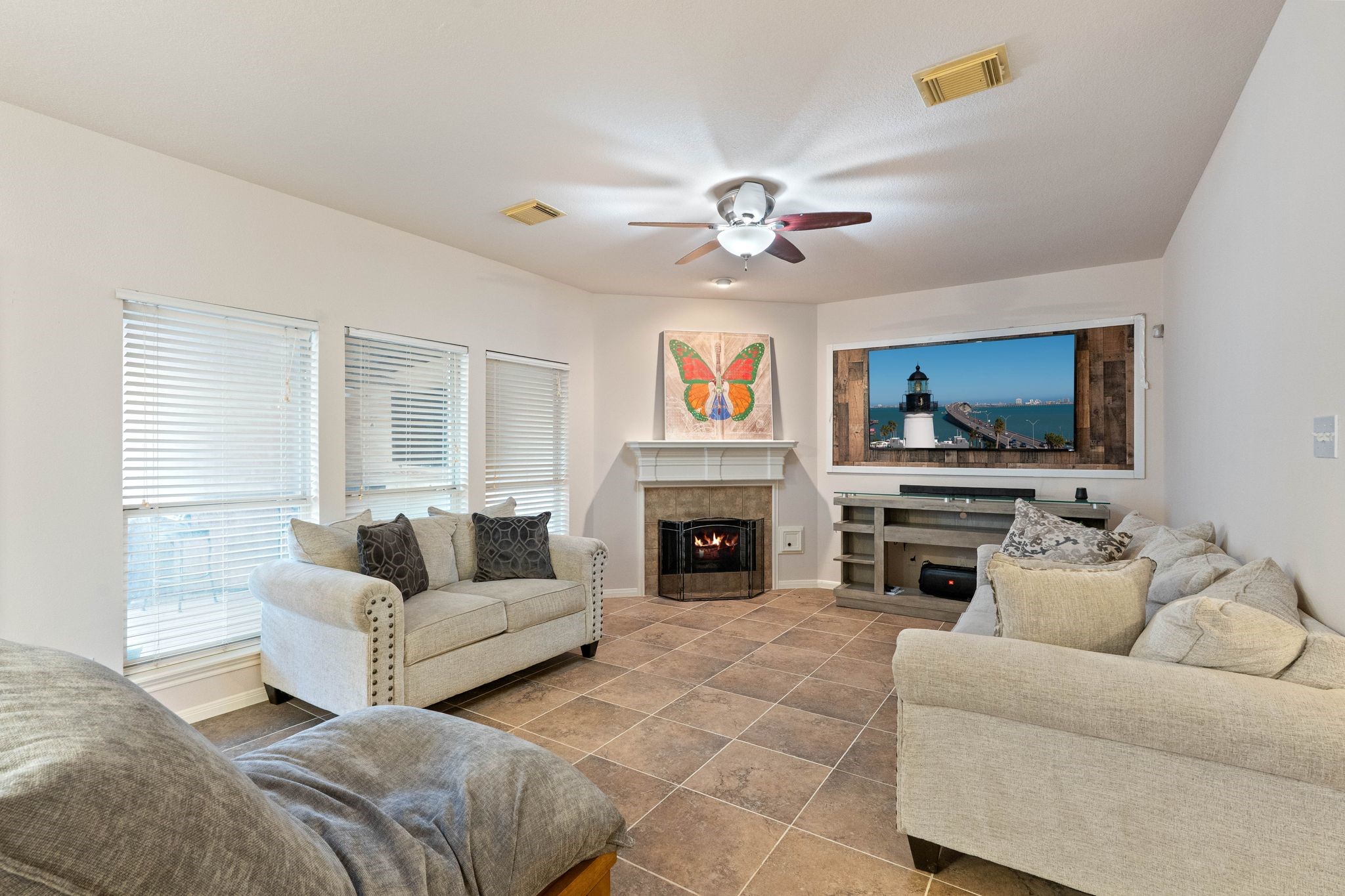 1908 Northampton Drive Conroe, TX 77303 - Photo 8 of 44 a living room with furniture a fireplace and a flat screen tv