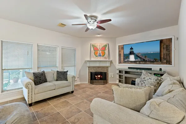 a living room with furniture and a fireplace