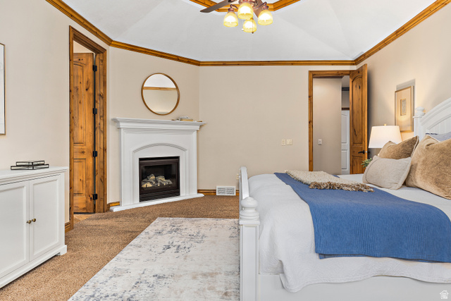 552 East Johns Way Sandy, UT 84070 - Photo 24 of 67 Vaulted ceiling with wood-finish trim, ceiling fan with integrated lighting, corner fireplace with white mantel, wood-finish interior doors