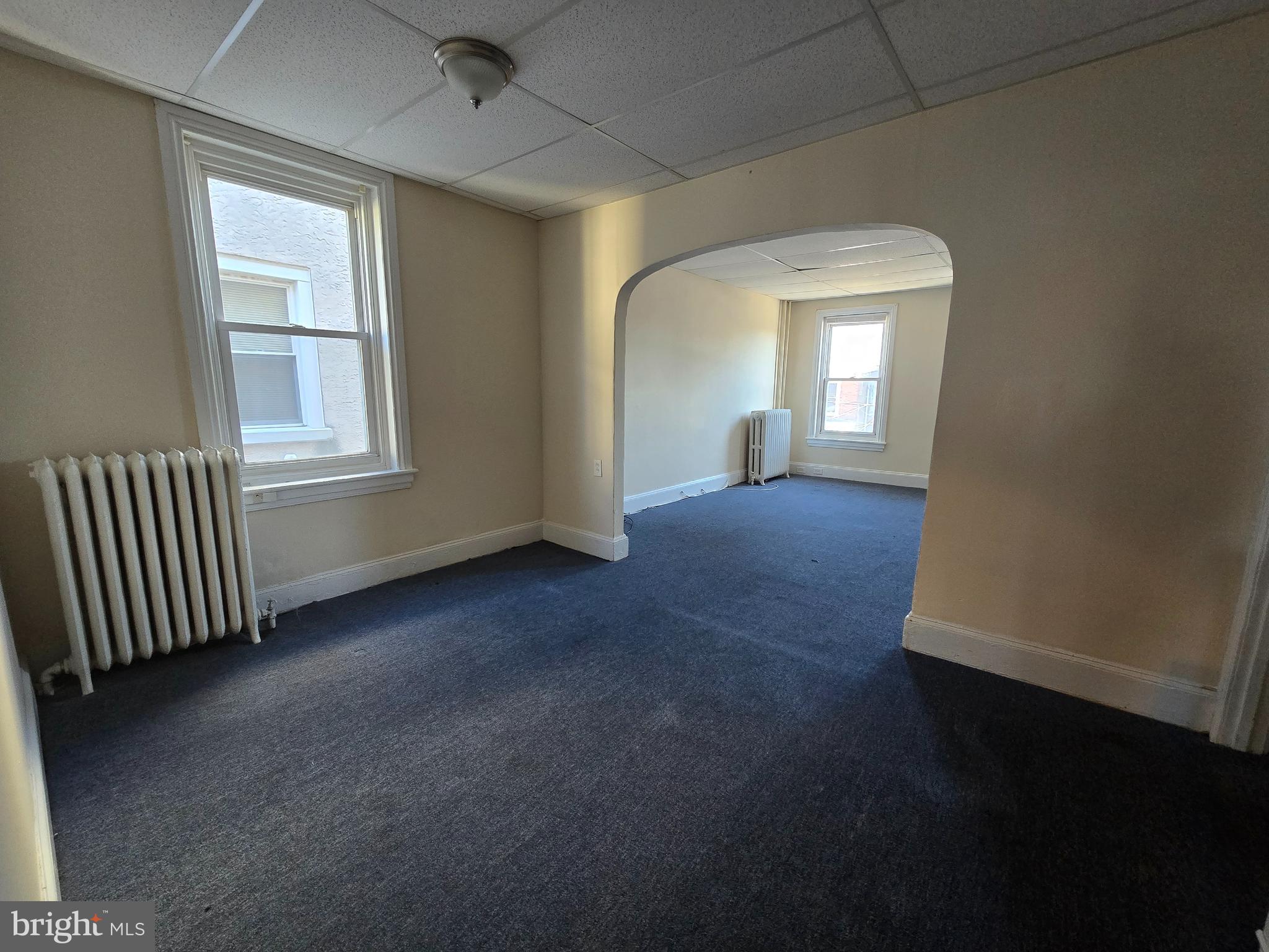 4820 Griscom Street, Unit B Philadelphia, PA 19124 - Photo 11 of 17 an empty room with windows and closet
