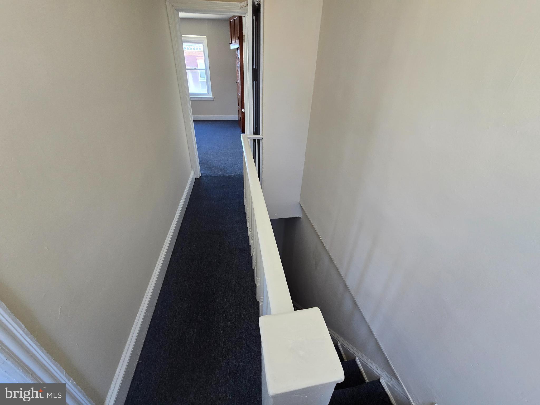4820 Griscom Street, Unit B Philadelphia, PA 19124 - Photo 6 of 17 a view of a hallway with wooden floor and staircase