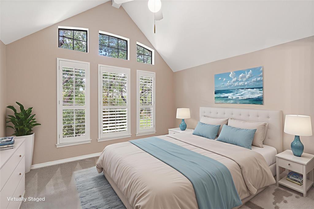 7016 Harvey Lane Plano, TX 75025 - Photo 17 of 26 a bedroom with a large bed and a window