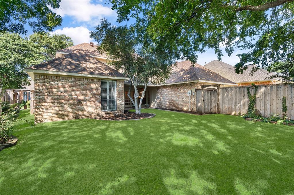 7016 Harvey Lane Plano, TX 75025 - Photo 26 of 26 a view of a back yard of the house with green space