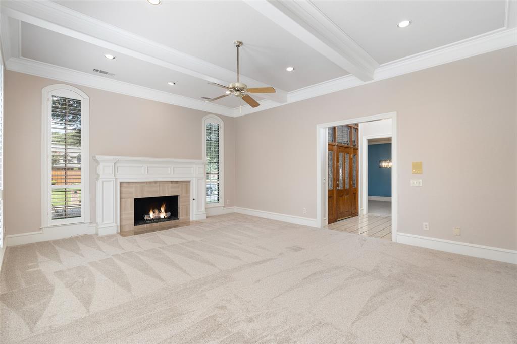7016 Harvey Lane Plano, TX 75025 - Photo 4 of 26 a view of an empty room with a fireplace