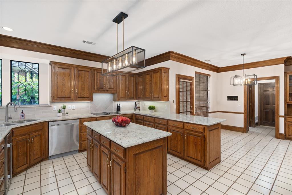 7016 Harvey Lane Plano, TX 75025 - Photo 8 of 26 a kitchen with a sink stove and cabinets