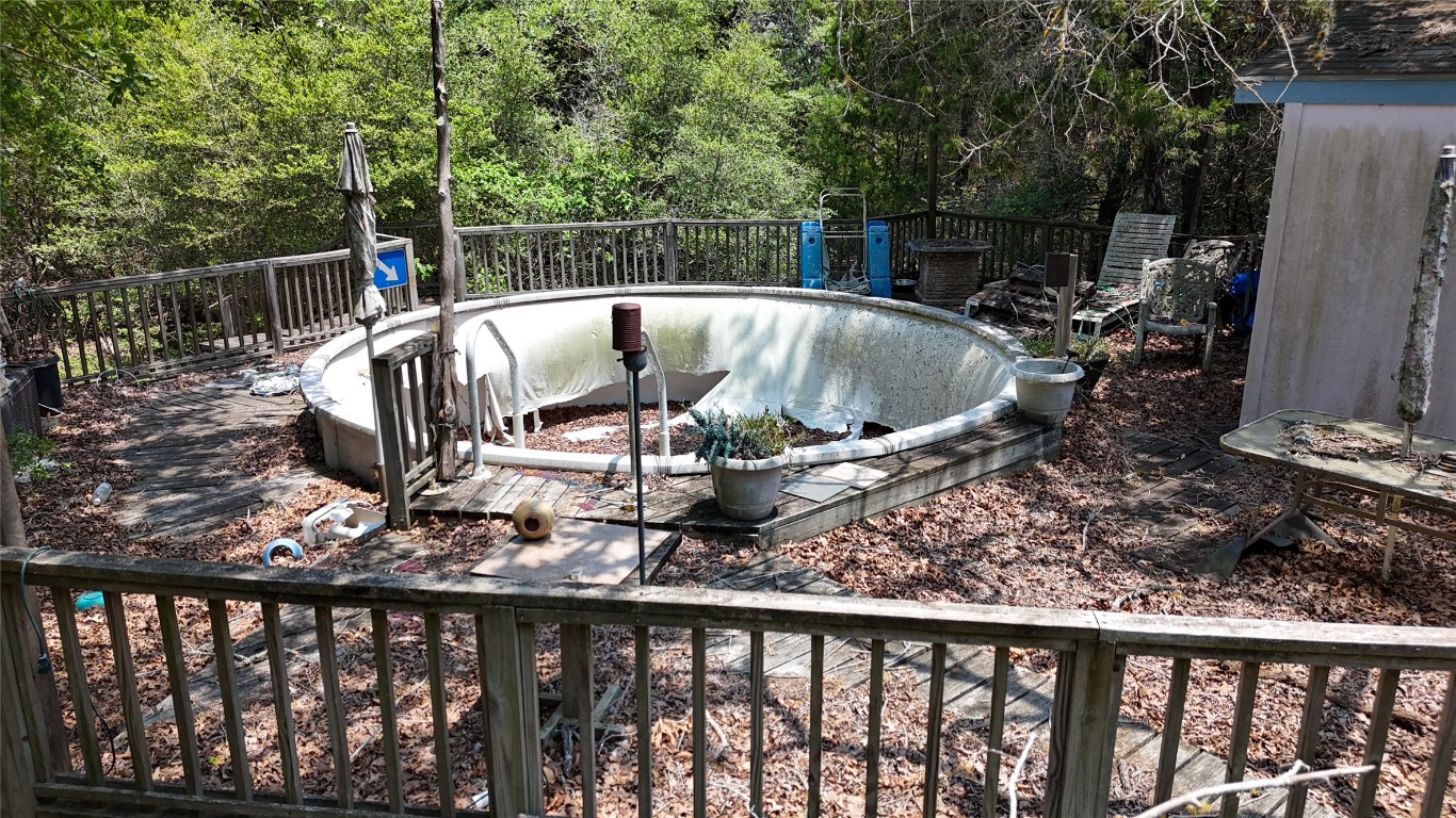 642 Hidden Oaks Drive Elgin, TX 78621 - Photo 13 of 36 a view of a balcony with two chairs and a table