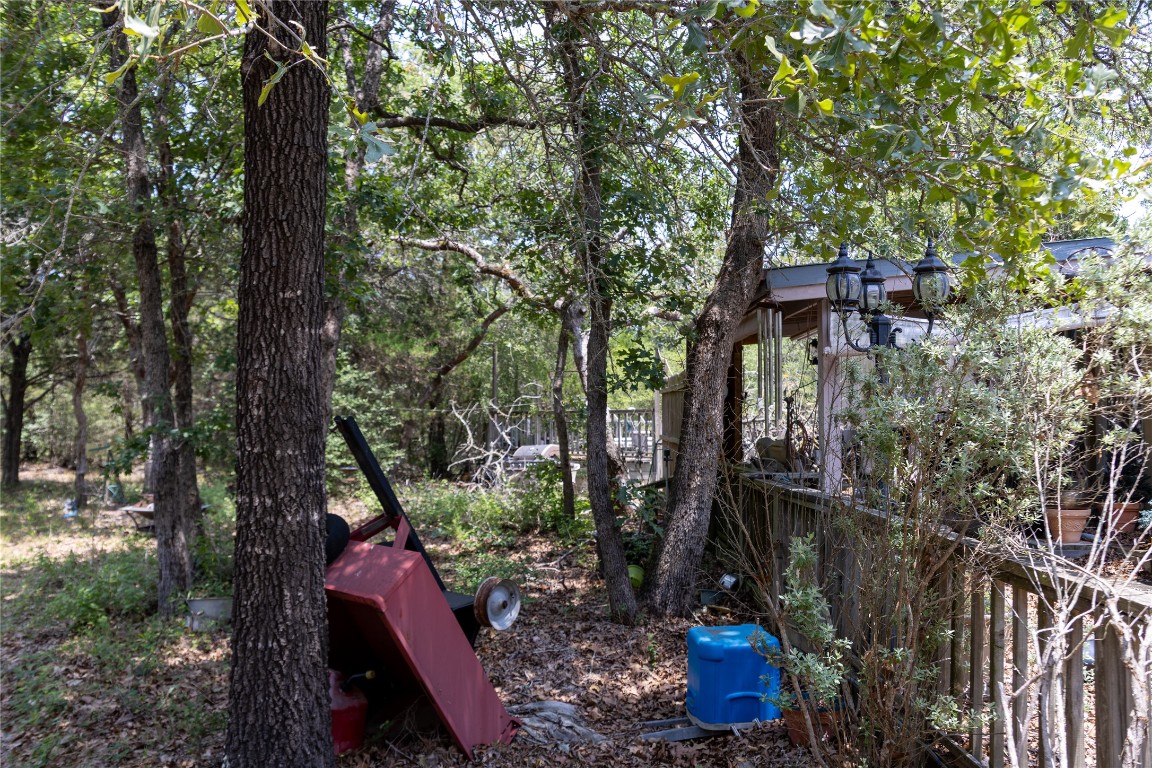 642 Hidden Oaks Drive Elgin, TX 78621 - Photo 14 of 36 a view of a pathway along with potted plants