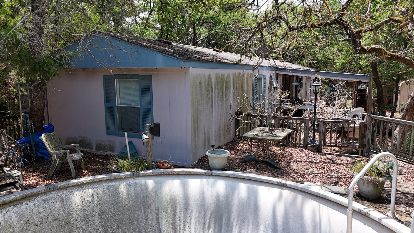 642 Hidden Oaks Drive Elgin, TX 78621 - Photo 8 of 36 a backyard of a house with yard and outdoor seating