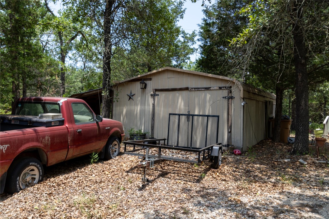 642 Hidden Oaks Drive Elgin, TX 78621 - Photo 10 of 36 a front view of a house with a yard and garage