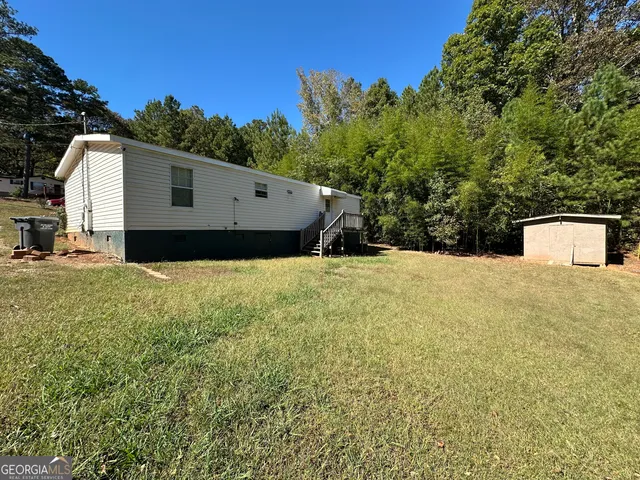 a view of a back yard of the house