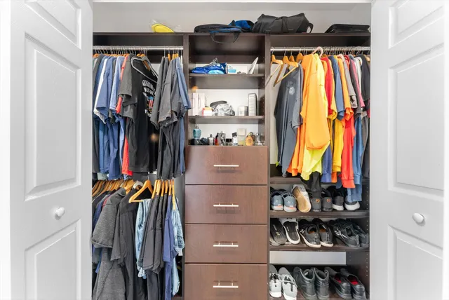 a en suite bathroom with a glass shower door and a bathroom