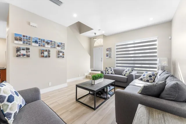 a living room with furniture and windows