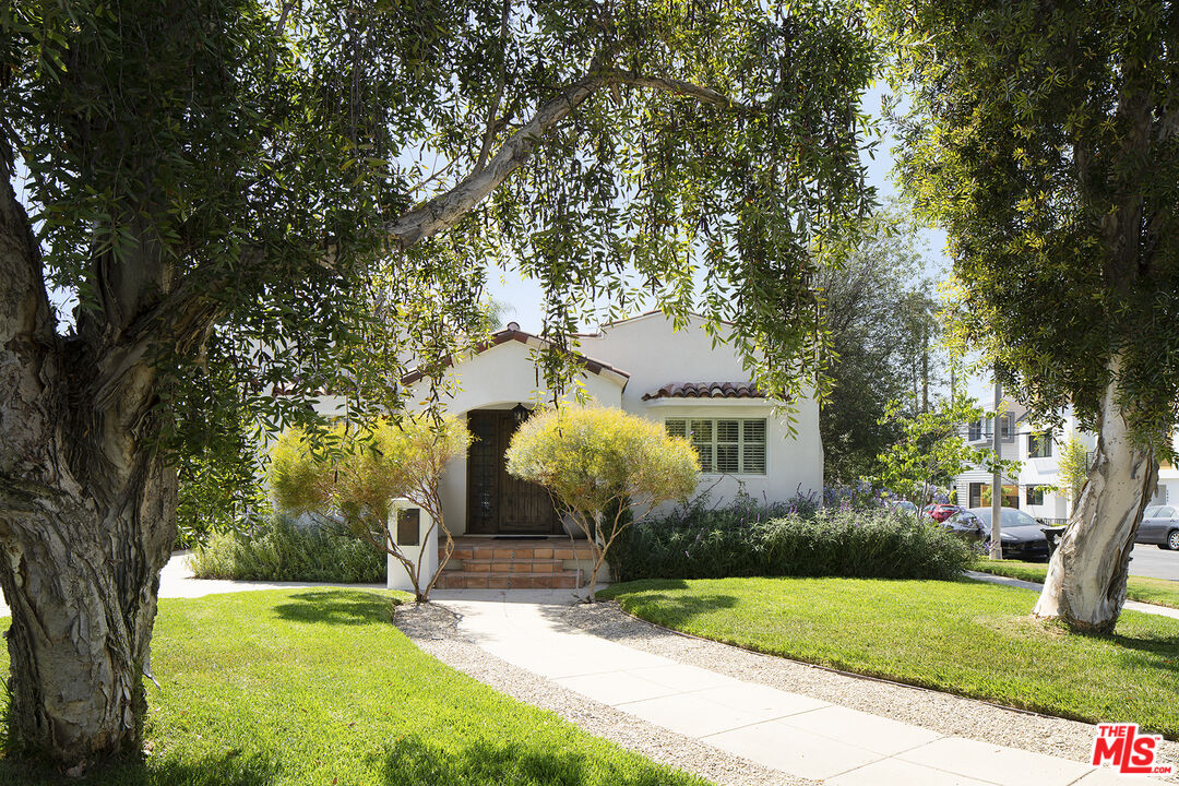 1601 Hi Point Street Los Angeles, CA 90035 - Photo 1 of 25 a front view of a house with garden