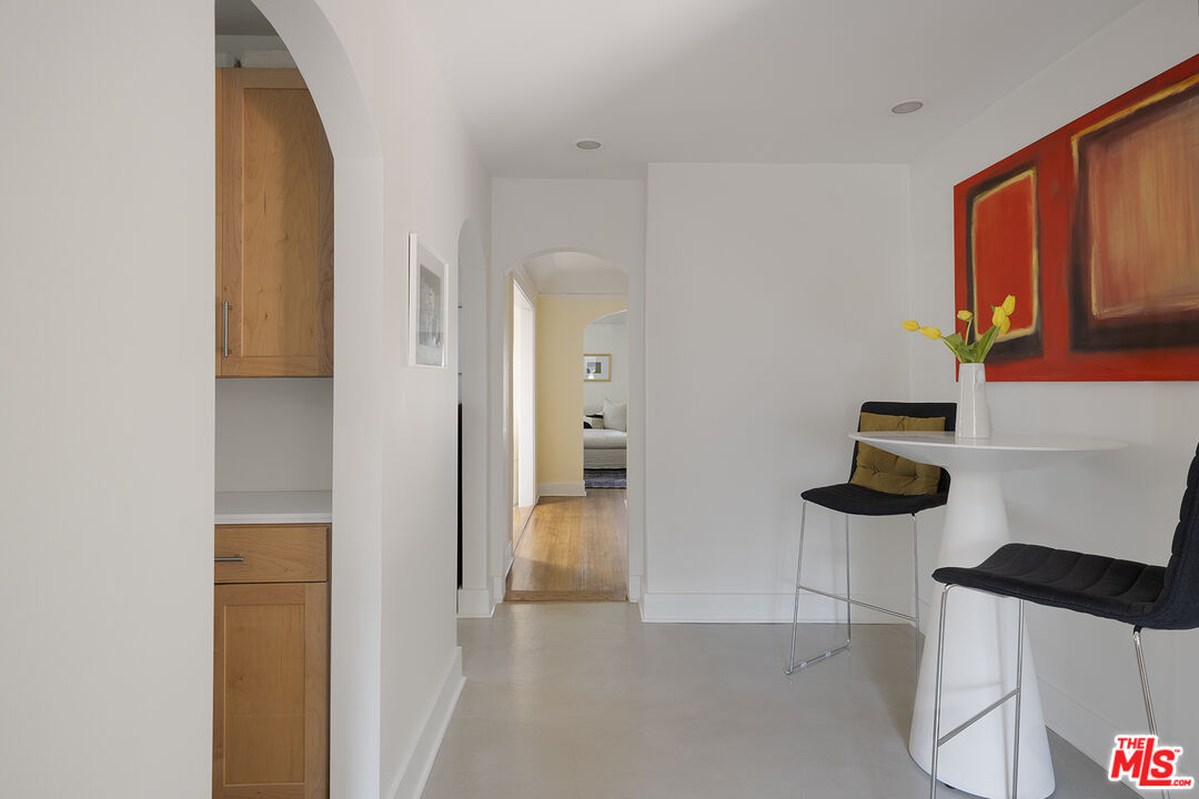 1601 Hi Point Street Los Angeles, CA 90035 - Photo 13 of 25 a view of hallway with seating and wooden floor