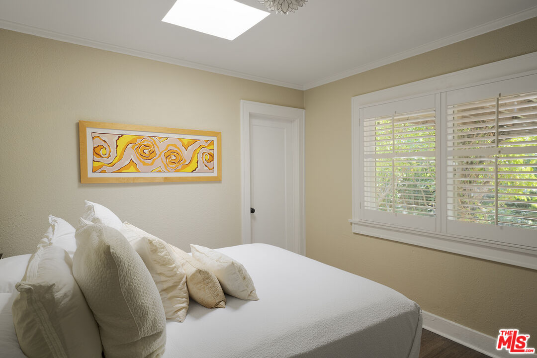 1601 Hi Point Street Los Angeles, CA 90035 - Photo 14 of 25 a bedroom with a bed and a window