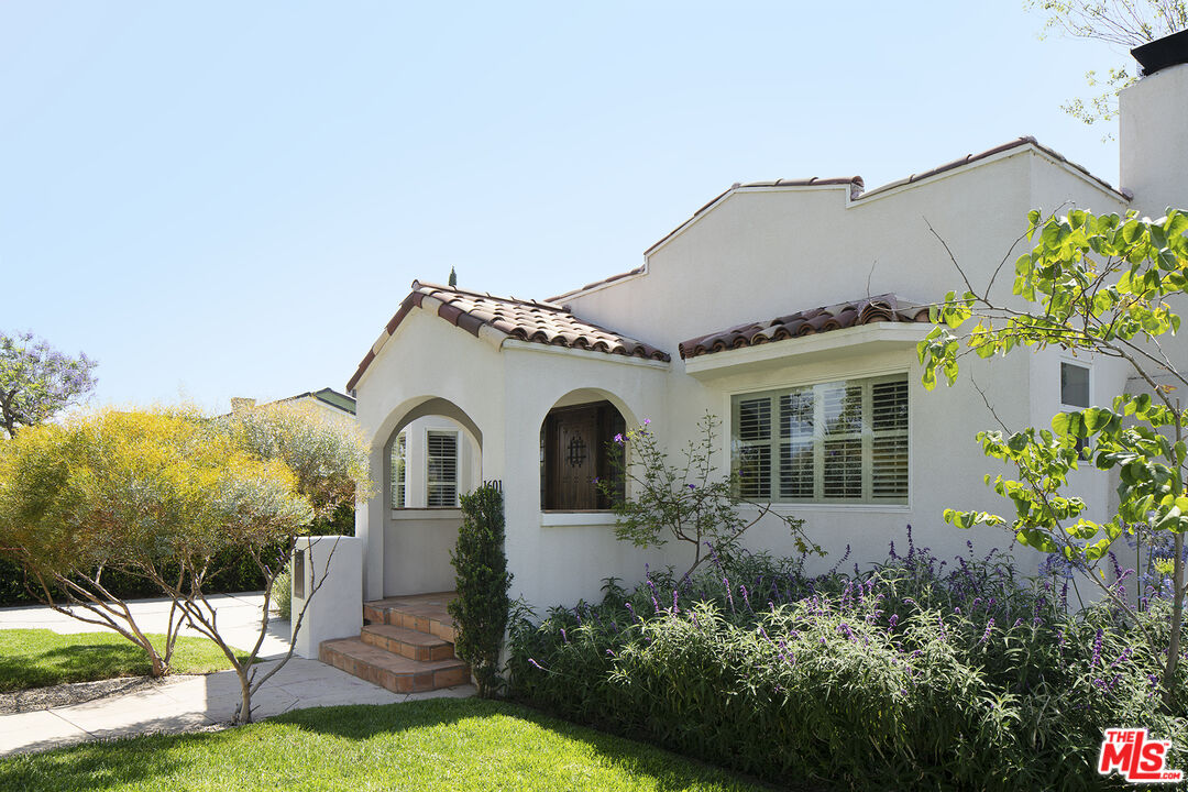 1601 Hi Point Street Los Angeles, CA 90035 - Photo 2 of 25 a front view of a house with a garden