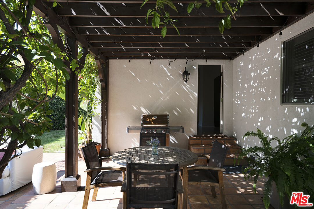 1601 Hi Point Street Los Angeles, CA 90035 - Photo 21 of 25 a view of a dinning table and chairs in patio