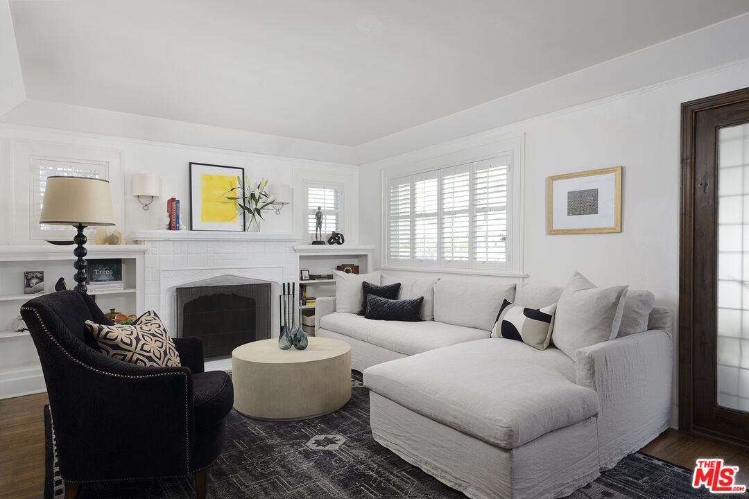 1601 Hi Point Street Los Angeles, CA 90035 - Photo 5 of 25 a living room with furniture and a fireplace
