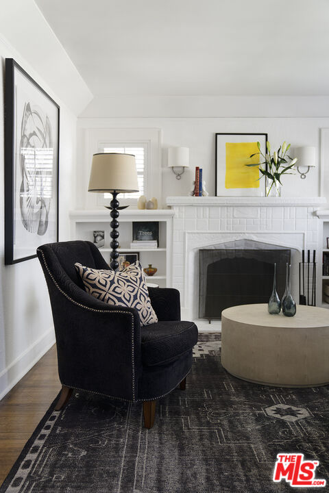 1601 Hi Point Street Los Angeles, CA 90035 - Photo 6 of 25 a living room with furniture a window and a fireplace