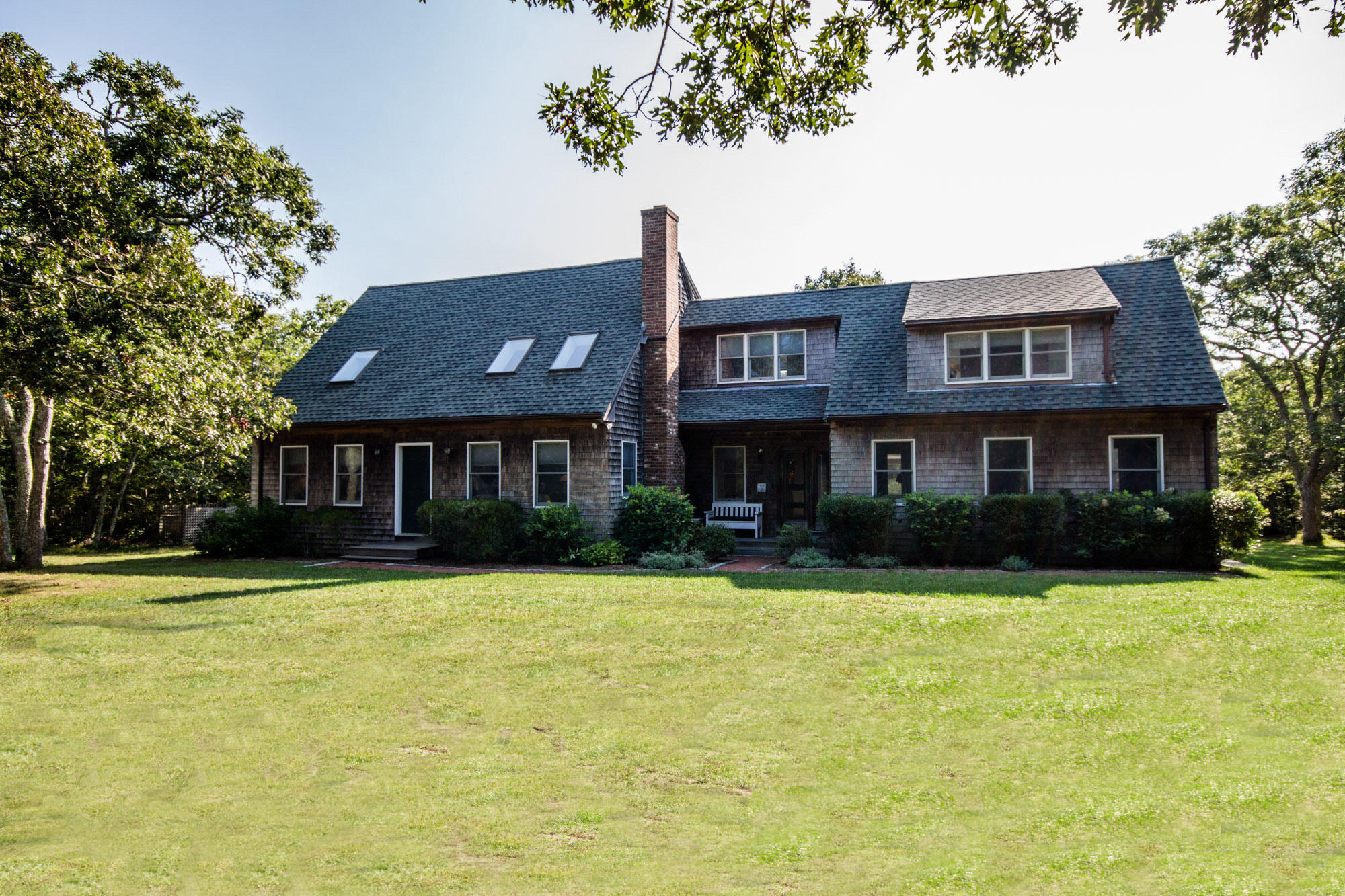 321 Chappaquiddick Road Edgartown, MA 02539 - Photo 1 of 35 a front view of a house with a yard