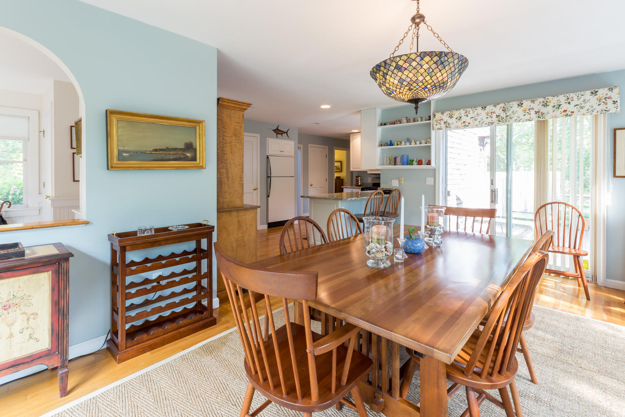 321 Chappaquiddick Road Edgartown, MA 02539 - Photo 12 of 35 a dining room with furniture a chandelier and wooden floor