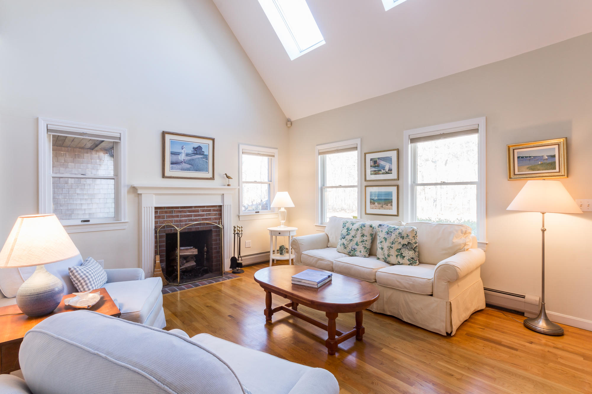321 Chappaquiddick Road Edgartown, MA 02539 - Photo 14 of 35 a living room with furniture a fireplace and a table