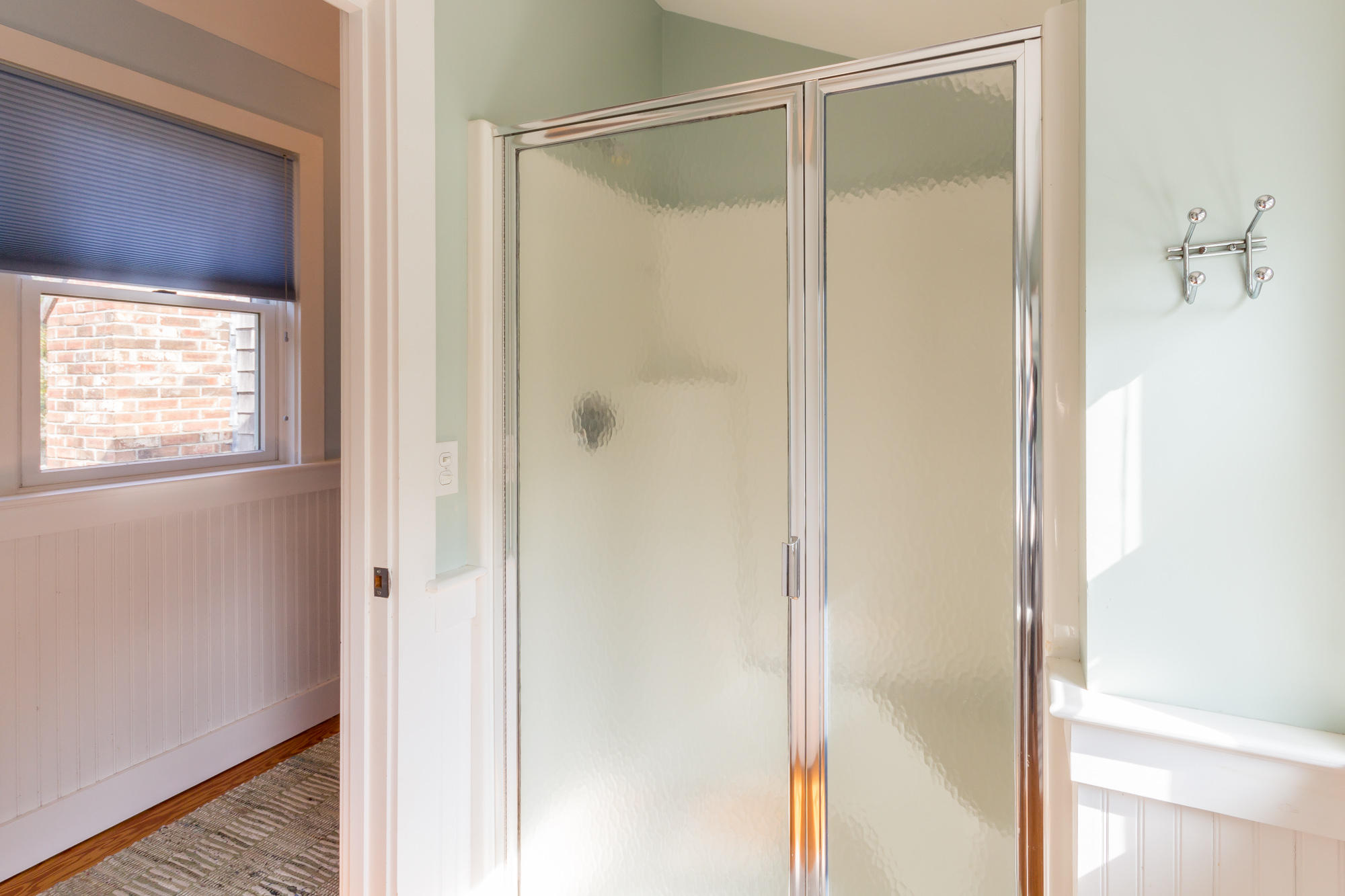 321 Chappaquiddick Road Edgartown, MA 02539 - Photo 27 of 35 a bathroom with a glass shower door