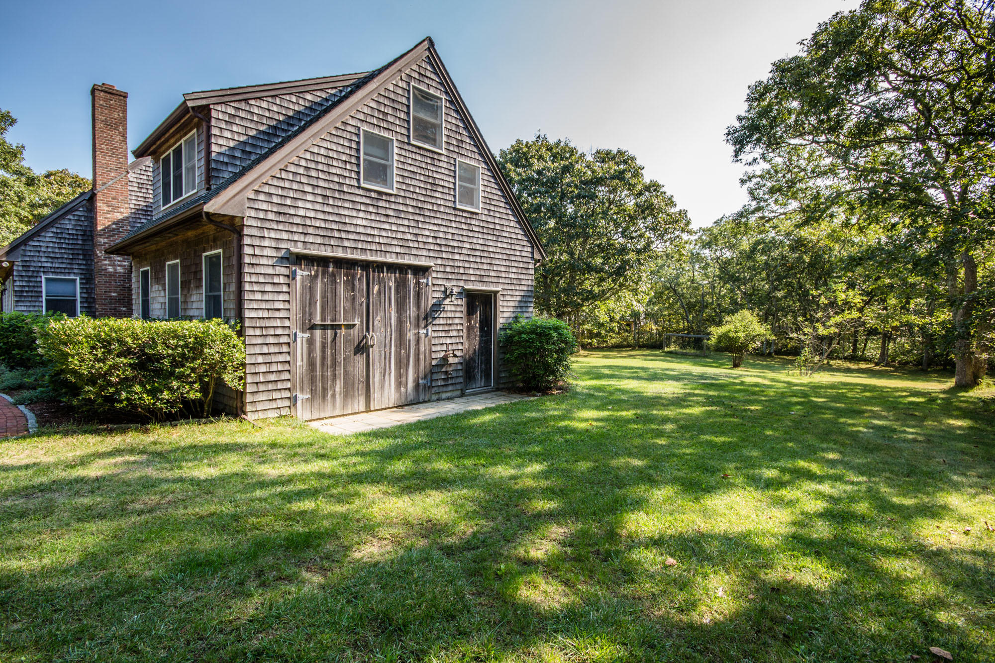 321 Chappaquiddick Road Edgartown, MA 02539 - Photo 3 of 35 a view of a house with a yard