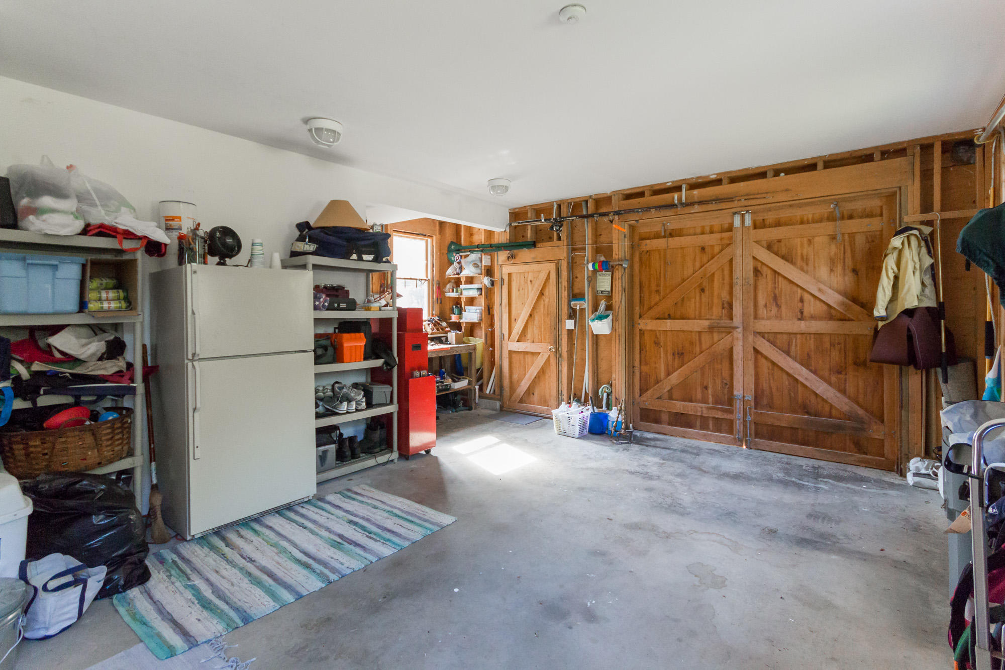 321 Chappaquiddick Road Edgartown, MA 02539 - Photo 31 of 35 a view of walk in closet with clothes and shoes